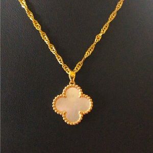 18K solid gold (not filled or plated) mother of pearl clover pendant.